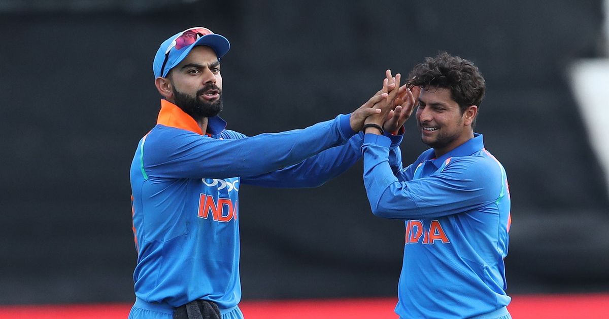 Virat Kohli celebrates a wicket with Kuldeep Yadav. Credit: Getty Images