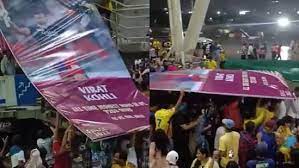 IPL 2023 [WATCH]: Virat Kohli’s Poster Helped Fans Survive The Relentless Downpour
