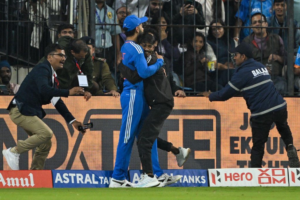 Intruder embraces Virat Kohli