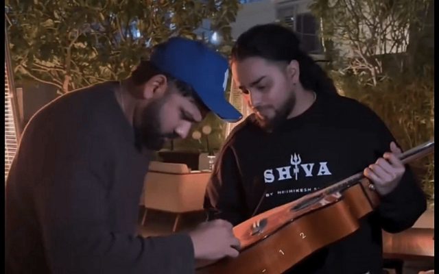 [WATCH]- Rohit Sharma Signs Fan’s Guitar In Dubai Before IND vs NZ 2025 Champions Trophy Match