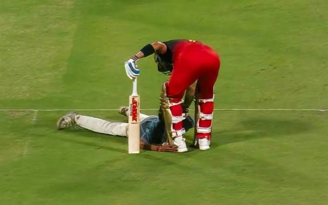 [Watch]: Fan Breaks Security And Dives At Virat Kohli’s Feet During IPL 2025 Opener At Eden Gardens