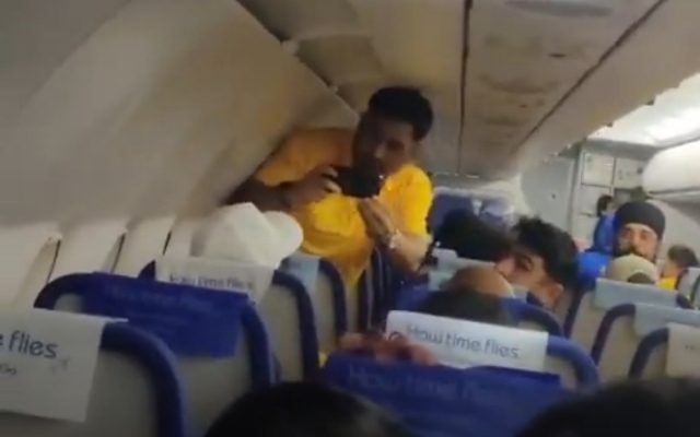 [WATCH]: MS Dhoni Records Video On A Fan’s Phone During Flight, Clip Goes Viral