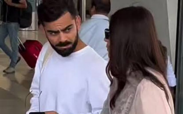 [WATCH]- Kohli Helps Paps With Perfect Shot As He Poses With Anushka Before RCB vs SRH IPL 2025 Match