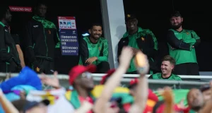 Sikandar Raza looks on as fans are celebrating after Zimbabwe qualified for the Super Eight. (Image: Getty Images)