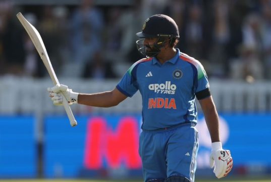 Rohit Sharma celebrates after scoring a century